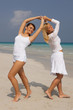 Two young women spending time at the beach