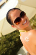 A sun made with suncream at the shoulder (shallow dof)