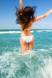Beautiful young woman having fun on the beach Beautiful young woman having fun on the beach
