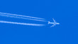Plane flying through blue sky