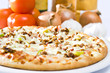 hot pan pizza with cheese on a dish.