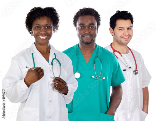 Photo: Team of young doctors a over white background Team of young doctors a over white background