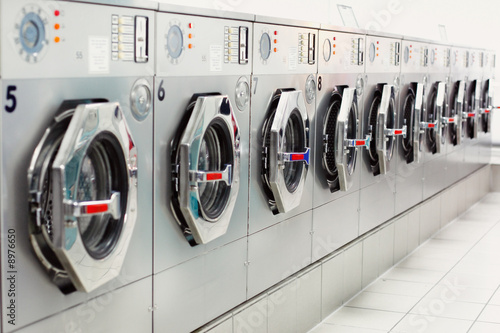 Photo: A row of industrial washing machines A row of industrial washing machines