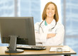 Doctor Woman Sitting On Her Desk