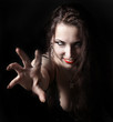 sexy vampire-girl on black background