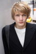 Portrait of teenage boy in street, looking at camera