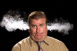 Photo: A man is angry and venting smoke A man is angry and venting smoke