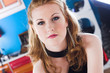 A young woman looks glamorous in a black evening dress