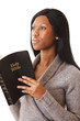 This is an image of a woman mediating on the bible. This is an image of a woman mediating on the bible.