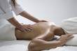 Woman in a day spa getting a deep tissue massage therapy.