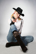 sexy cowgirl with old-fashioned gun