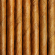 Cigars in a row close-up, may be used as background