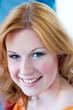 Close up of an attractive, smiling, blue eyed, teenager