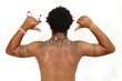 Photo: Portrait of young healthy latino man showing his back - isolated Portrait of young healthy latino man showing his back - isolated