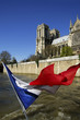 France, Paris, Notre Dame with French flag, low angle view