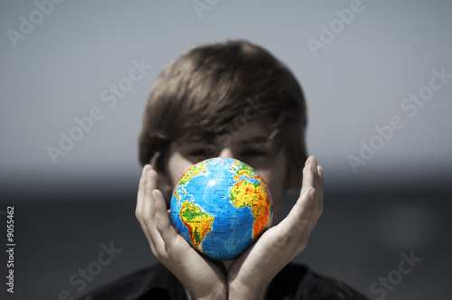 Photo: Earth globe in hands protected. Earth protection concept Earth globe in hands protected. Earth protection concept