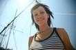 Portrait yong pretty woman in striped shirt on the ship