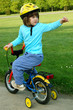 Little girl riding on her bike