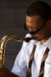 An youung and trendy African-American sax musician