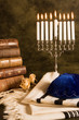 Hanukkah candleholder and jewish prayer shawl, books and cap