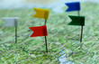 Side view of flag pins show direction of several places.