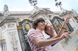 Couple sightseeing with map