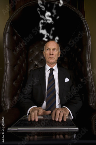 Photo: Businessman typing on laptop Businessman typing on laptop