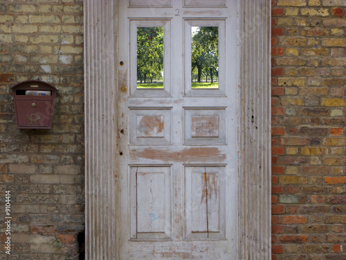 Photo: Old-fashioned door and brick house Old-fashioned door and brick house