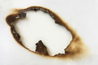Burn hole in white paper.