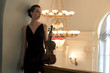 The beauty brunette plays the violin in concert hall