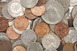 A macro studio shot of a pile of dirty coins.