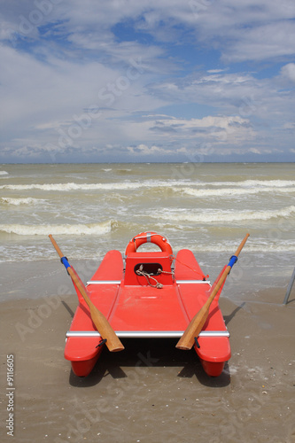 Photo: Lifeguard station,Lifeguard man watching the sea in Italy Lifeguard station,Lifeguard man watching the sea in Italy