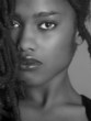 Lovely Closeup of beautiful Black woman on grey