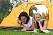 Couple Reading Map in Tent