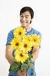 Smiling man holding bouquet. Smiling man holding bouquet.