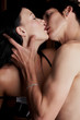 Young adult Caucasian couple in passionate embrace