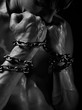 Close-up shot of male hands wound by chain