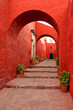 red old traditional building with arch red old traditional building with arch