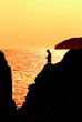 child fishing at dusk
