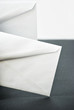 white envelopes against white and black