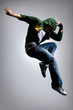 Foto: cool looking dancer makes a difficult jump cool looking dancer makes a difficult jump