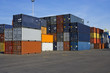 Stacks of orange and blue containers in a major port