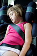 little girl sleeping in safety car seat