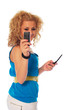 Young blonde girl taken picture with mobil phone