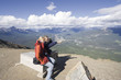family having a break on the top of a mountain