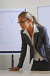 business woman making a presentation on a flipchart business woman making a presentation on a flipchart