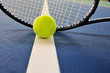 Tennis ball and racquet on the court Tennis ball and racquet on the court