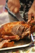 Carving a roast duck for Christmas lunch..