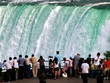 People on falling water background. Niagara Falls