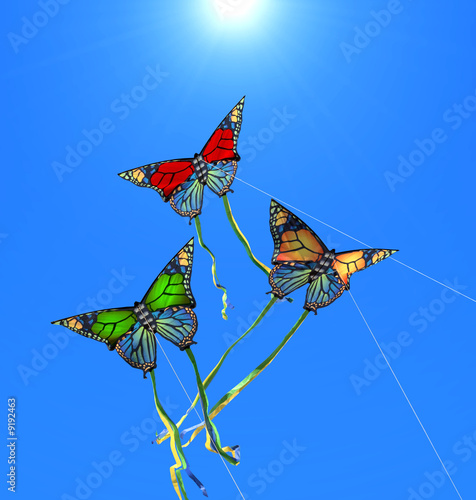 Photo: Three colorful kites at sunny sky Three colorful kites at sunny sky